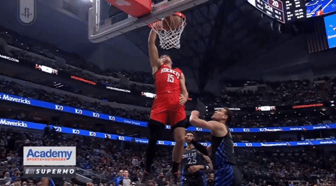 A Basketball Player With The Number 15 On His Jersey Jumps Up To Throw The Ball GIF