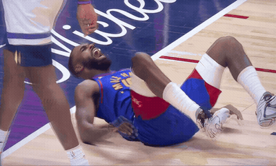 A Basketball Player With The Number 15 On His Jersey Lays On The Floor GIF