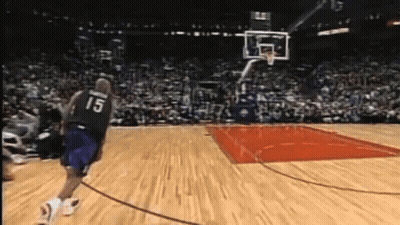 A Basketball Player With The Number 15 On His Jersey Runs Towards The Basket GIF