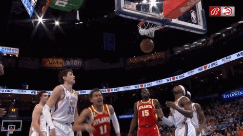 A Basketball Player With The Number 15 On His Jersey Tries To Block A Shot GIF