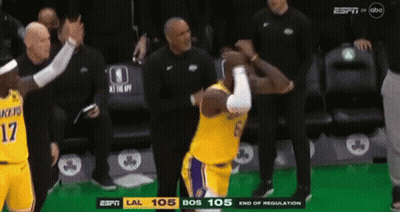 A Basketball Player With The Number 17 On His Jersey Is Standing In Front Of A Referee . GIF