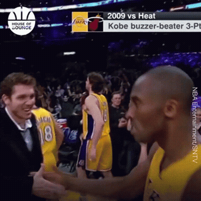 a basketball player with the number 18 on his jersey is talking to another player