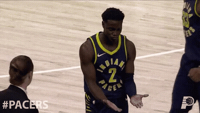 A Basketball Player With The Number 2 On His Jersey Talks To A Referee GIF