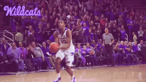 A Basketball Player With The Number 20 On His Jersey Is Dribbling The Ball GIF