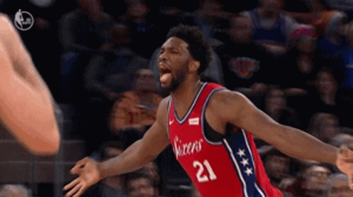 A Basketball Player With The Number 21 On His Shirt GIF