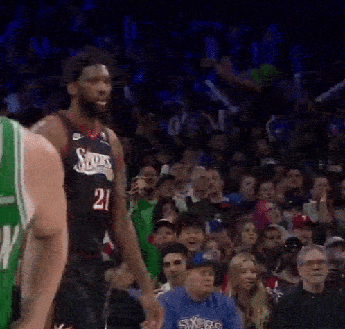 A Basketball Player With The Number 21 On His Shirt GIF