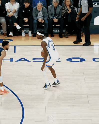 A Basketball Player With The Number 22 On His Jersey Dribbles The Ball GIF