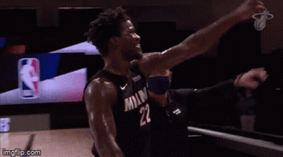 A Basketball Player With The Number 22 On His Jersey Is Celebrating . GIF