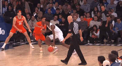 A Basketball Player With The Number 22 On His Jersey Is Dribbling The Ball GIF