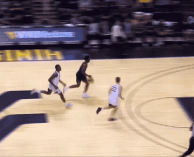 A Basketball Player With The Number 22 On His Jersey Is Dribbling The Ball GIF