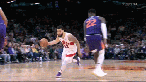 A Basketball Player With The Number 22 On His Shorts Dribbles The Ball GIF