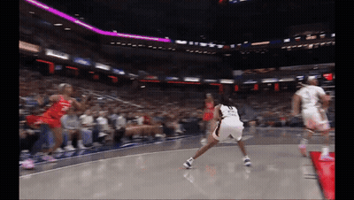 A Basketball Player With The Number 23 On Her Shorts Is Dribbling The Ball GIF