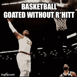 A Basketball Player With The Number 23 On His Jersey Is Dunking A Basketball . GIF