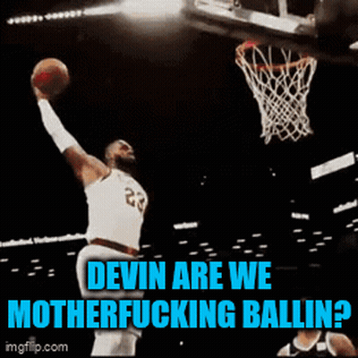A Basketball Player With The Number 23 On His Jersey Is Dunking The Ball GIF
