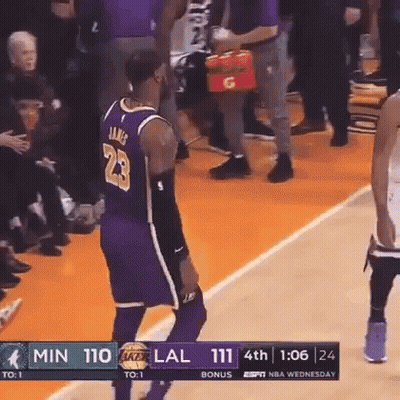 A Basketball Player With The Number 23 On His Jersey Is Standing On The Court GIF