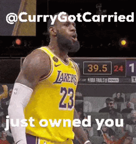 A Basketball Player With The Number 23 On His Jersey Stands On A Court GIF