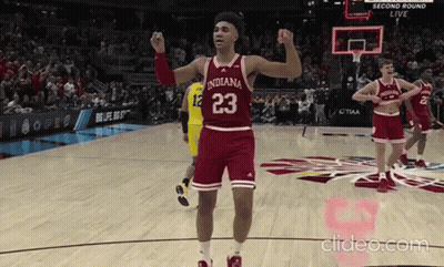 A Basketball Player With The Number 23 On His Jersey Stands On The Court GIF