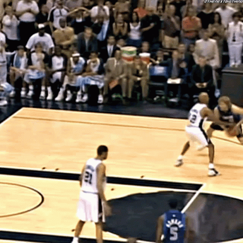 A Basketball Player With The Number 23 On His Jersey Stands On The Court GIF