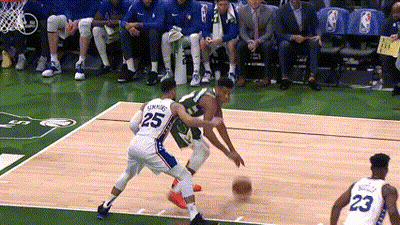 A Basketball Player With The Number 25 On His Back Dribbles The Ball GIF