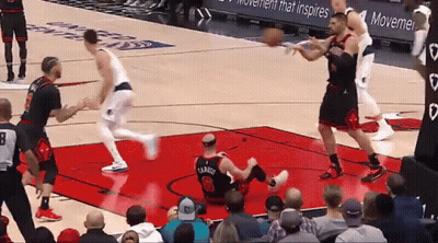 A Basketball Player With The Number 26 On His Jersey Is Laying On The Floor GIF