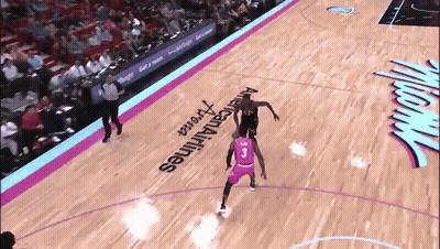 A Basketball Player With The Number 3 On His Jersey Dribbles The Ball GIF