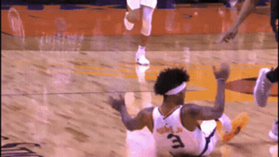 A Basketball Player With The Number 3 On His Jersey Falls To The Floor GIF