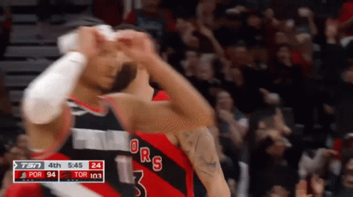 A Basketball Player With The Number 3 On His Jersey Is Celebrating GIF