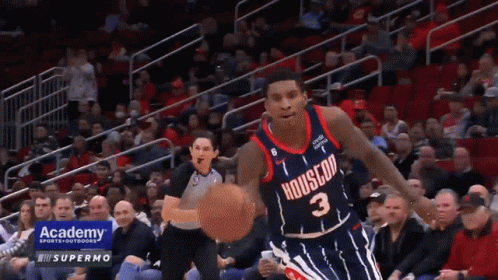 A Basketball Player With The Number 3 On His Jersey Is Dribbling The Ball GIF