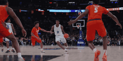 A Basketball Player With The Number 3 On His Jersey Is Dribbling The Ball GIF