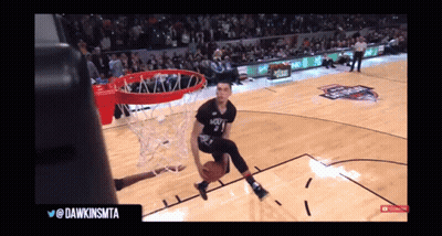 A Basketball Player With The Number 3 On His Jersey Is Going For A Dunk GIF