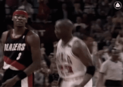 A Basketball Player With The Number 3 On His Jersey Is Standing Next To Another Player . GIF
