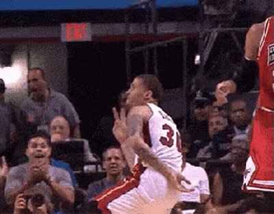 A Basketball Player With The Number 3 On His Jersey Jumps In The Air GIF