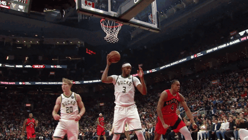 A Basketball Player With The Number 3 On His Jersey Throws The Ball GIF