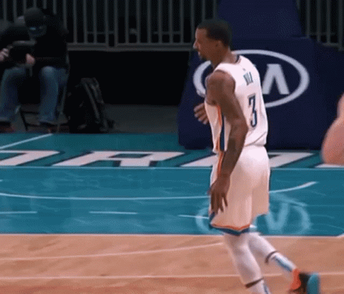 A Basketball Player With The Number 3 On His Jersey Walks On The Court GIF