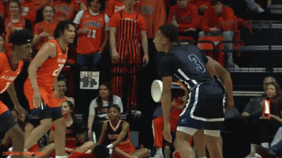 A Basketball Player With The Number 3 On His Shorts Stands In Front Of A Crowd GIF