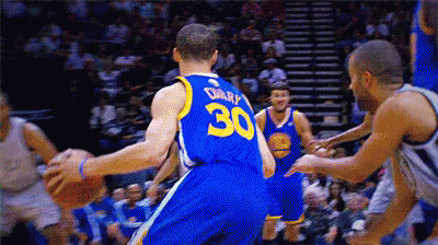 A Basketball Player With The Number 30 On His Back Dribbles The Ball GIF