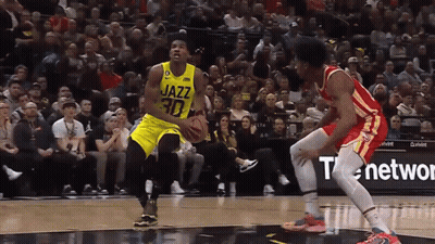 A Basketball Player With The Number 30 On His Jersey Dribbles The Ball GIF