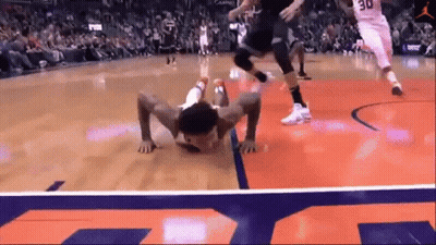 A Basketball Player With The Number 30 On His Jersey Is Crawling On The Court GIF