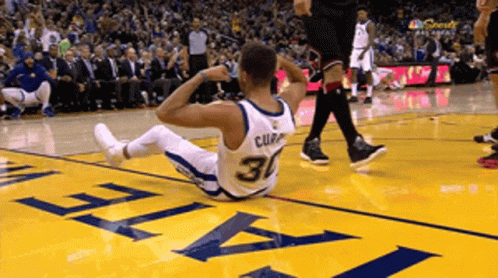 A Basketball Player With The Number 30 On His Jersey Lays On The Floor GIF