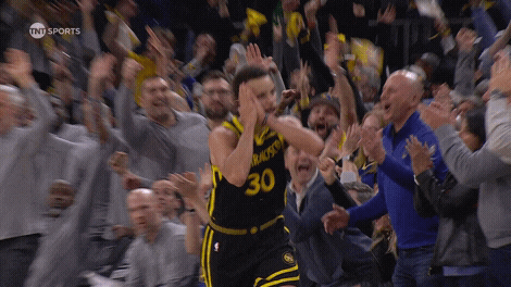 A Basketball Player With The Number 30 On His Jersey Stands In Front Of A Crowd GIF