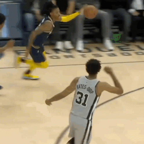 A Basketball Player With The Number 31 On His Jersey Is Dribbling The Ball GIF