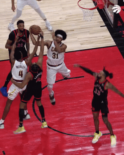 A Basketball Player With The Number 31 On His Jersey Is Trying To Get The Ball GIF