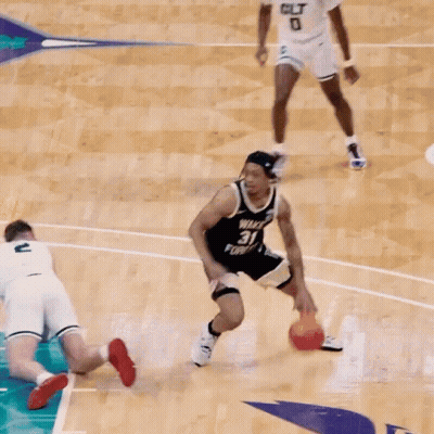 A Basketball Player With The Number 31 On His Jersey Tries To Block Another Player GIF