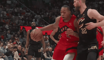 A Basketball Player With The Number 32 On His Jersey Tries To Block Another Player GIF