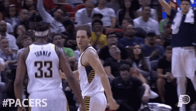 A Basketball Player With The Number 33 On His Back Is Talking To Another Player GIF
