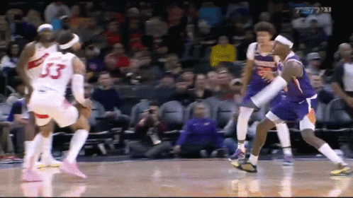 A Basketball Player With The Number 33 On His Jersey Is Surrounded By Other Players GIF