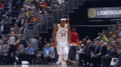 A Basketball Player With The Number 33 On His Jersey Is Walking On The Court GIF