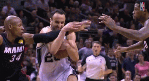 A Basketball Player With The Number 34 On His Jersey Is Being Fouled By Another Player GIF