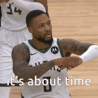 A Basketball Player With The Number 34 On His Jersey Is Giving A Fist Bump GIF