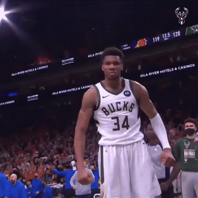 A Basketball Player With The Number 34 On His Jersey Stands On The Court GIF